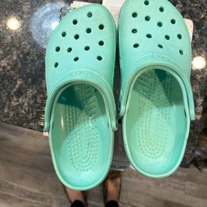 Mint green crocs